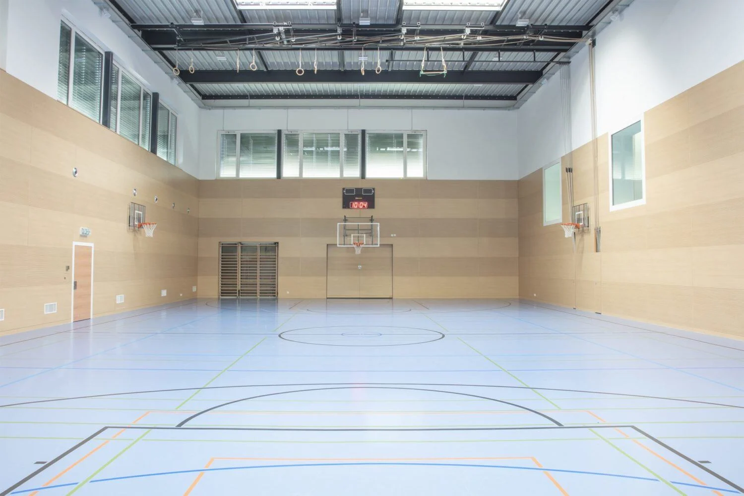 https://dlangbasketball.ch/wp-content/uploads/2025/06/One-of-our-three-gym-halls.-We-have-four-tennis-courts-one-full-sized-Astroturf-football-pitch-one-basketball-playground-and-one-fitness-centre-.webp